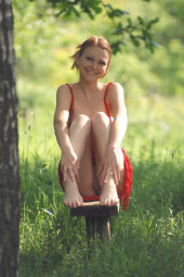 Puffy nipples redhead in sexy red summer dress showing her nude pussy and tits in the forest