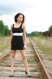 Sexy petite brunette is nude outdoor on the rails